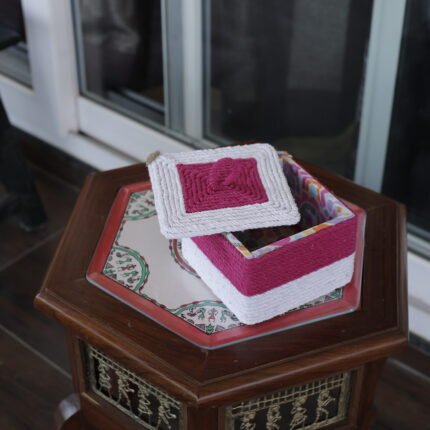 A beautiful jute basket with a lid for storage and gifting.