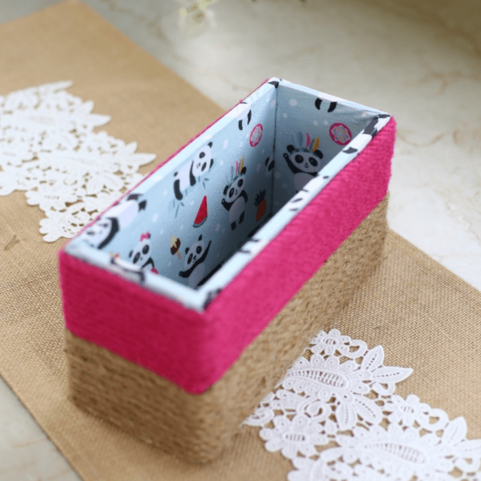 A stylish jute basket with a secure lid for neat storage.